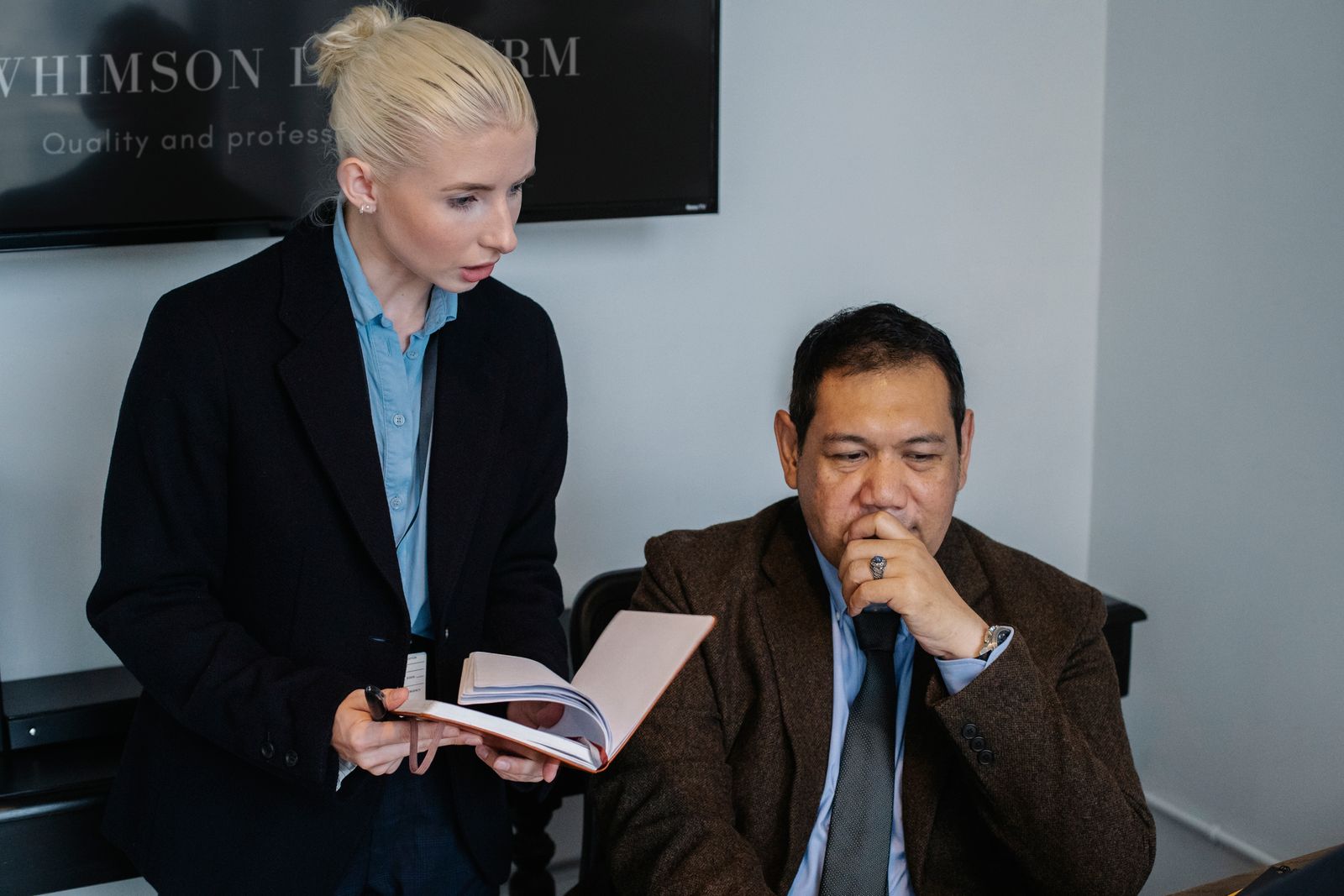 Consultant and business leader reviewing strategic notes